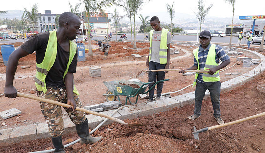 Workers at the Sonatubes roundabout in Kicukiro District on Tuesday. The City of Kigali will spend Rwf14 billion on upgrading city roads as it prepares to host at least 10,000 delegates during next yearu2019s Commonwealth Heads of Government Meeting (CHOGM).  Emmanuel Kwizera.