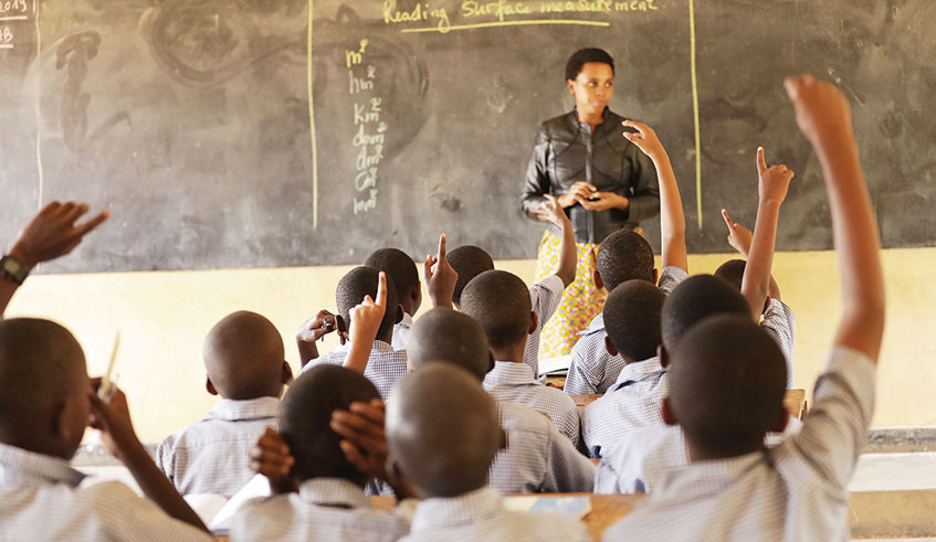A teacher and her class during a lesson at Rugando Primary School. File.