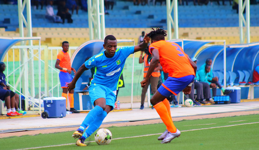AS Kigaliu2019s right-back Michel Rusheshangoga tries to dribble past Prolineu2019s Amos Kadikilo during the 1-1 draw at Kigali Stadium this month. Courtesy.