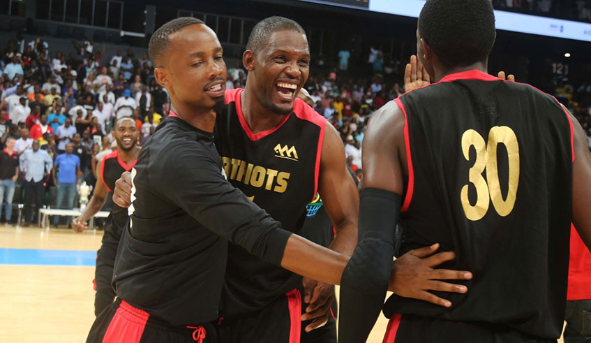 L-R_ Patriots players Lionnel Hakizimana, Michael Makiadi and Dieudonne Ndizeye (#30) celebrate after beating Rwanda Energy Group in Game 7 of the playoffs finals to retain the league title at Kigali Arena last Saturday. File.