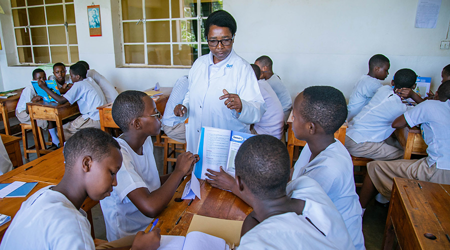 A female teacher interacts with students during a class at Institut Sainte Famille de Nyamasheke in Western Province. / Emmanuel Kwizera