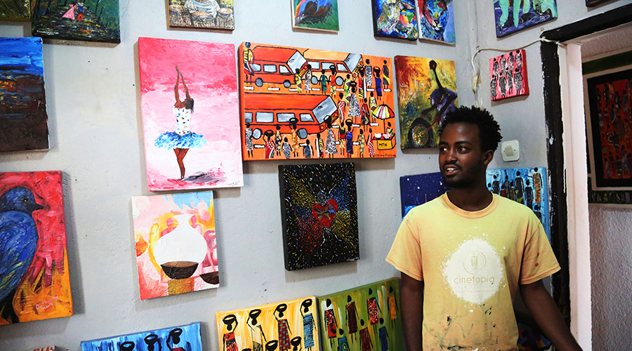 Emmanuel Mutuyimana talks about the art pieces at Ivuka Arts Gallery in Kigali. / Sam Ngendahimana