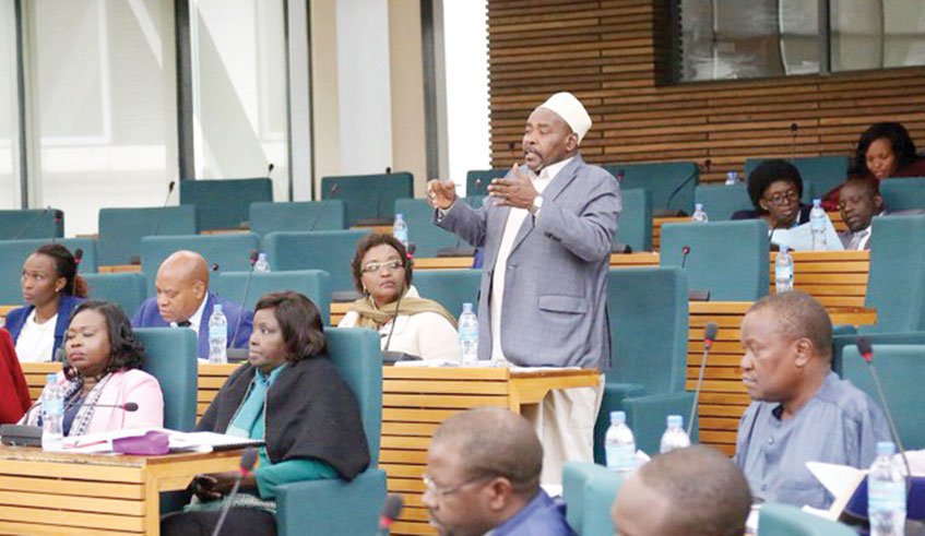 EALA members during a past plenary session in Arusha, Tanzania. The regional parliament has called on the blocu2019s Council of Ministers to address the issue of members  states that default on their financial obligations. Courtesy.