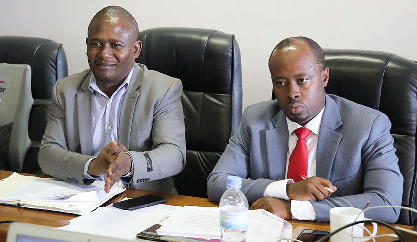 Philbert Zimulinda, the Division Manager of National Metrology at Rwanda Standad Board (left), speaks during the meeting with members of the parliamentary Standing Committee on Economy and Trade as RSB Director-General Raymond Murenzi looks on, yesterday. Craish Bahizi.