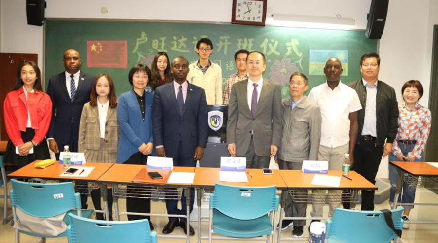 Chinese officials pose a group photo with the staff from Rwandan embassy in China during the launching ceremony of the Kinyarwanda course. / Courtesy