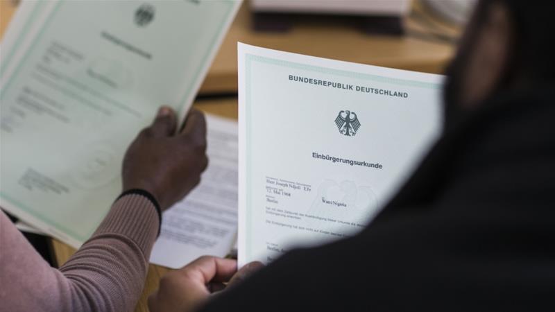 Among Nigeria's healthcare woes is the emigration of its physicians. Nine out of every ten doctors in Nigeria are seeking to leave the country and find work elsewhere - including the Nigerian doctor who is pictured here and signing paperwork to become a German citizen. / Reuters