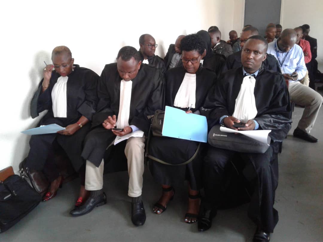 A team of lawyers representing suspected RNC operatives take their seats in court. (Emmanuel Kwizera)