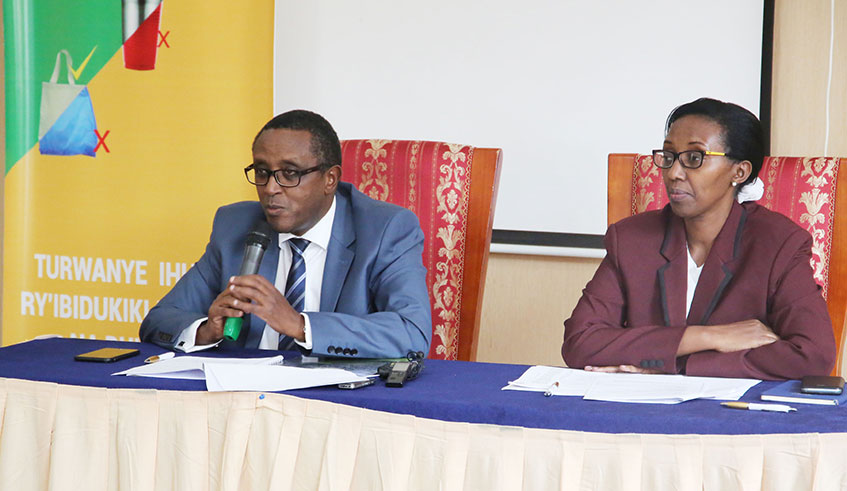 Environment minister Dr Vincent Biruta speaks during the news briefing as Coletha Ruhamya, the Director General of Rwanda Environment Management Authority looks on in Kigali yesterday. Photo: Craish Bahizi.
