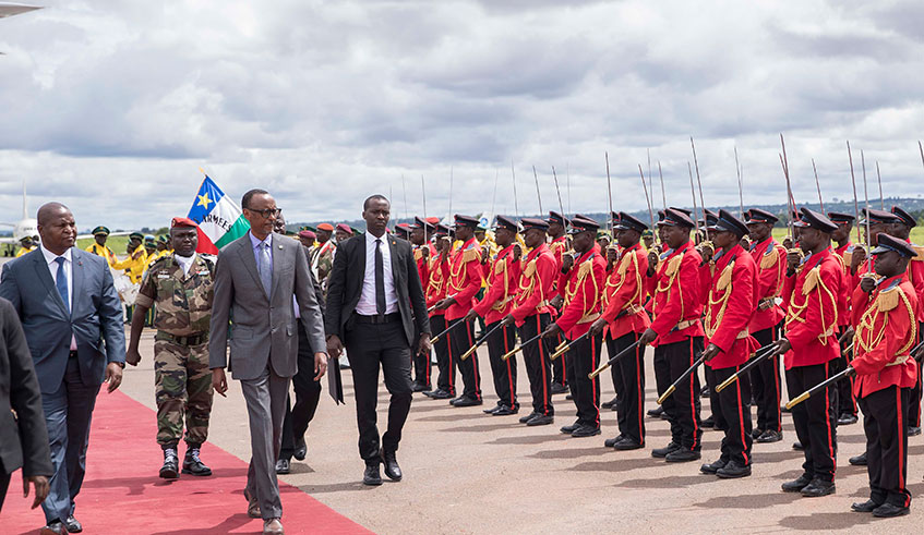 President Paul Kagame and President Faustin-Archange Touadu00e9ra of Central Africa Republic inspect the guard of honour in Bangui yesterday. Kagame was on a one-day state visit to CAR where Rwanda has maintained peacekeepers since 2014. Photo/Village Urugwiro.