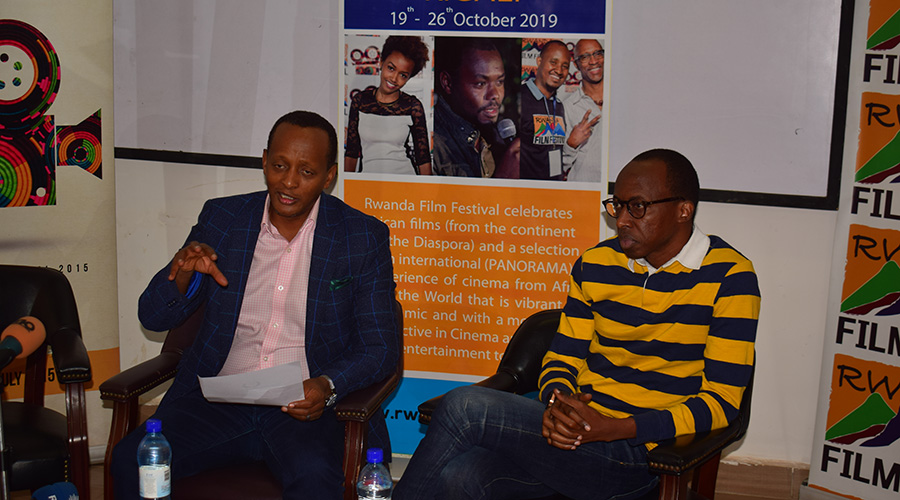 Eric Kabera (left), flanked by popular actor and comedian Diogene Ntarindwa, known as Atome, at the press conference to give out details about the Rwanda Film Festival. / Craish Bahizi