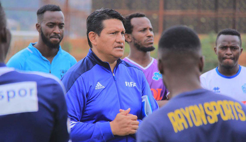 Rayon Sports head coach Javier Martinez Espinosa speaks to his players during a recent training session at Nzove training ground in Kigali. Courtesy.