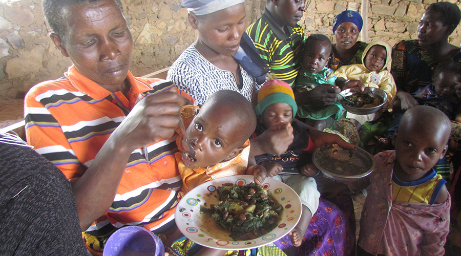 Mothers feed their children in a move to prevent malnutrition in Nyabihu District recently. / Ru00e9gis Umurengezi