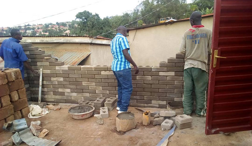 Constructors join the interlock  bricks in Kigali. Photos by Joan Mbabazi.