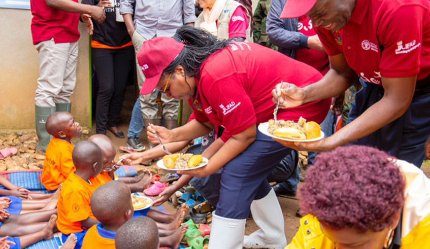 Officials feed kids from Rutsiro District with balanced diet. Courtesy