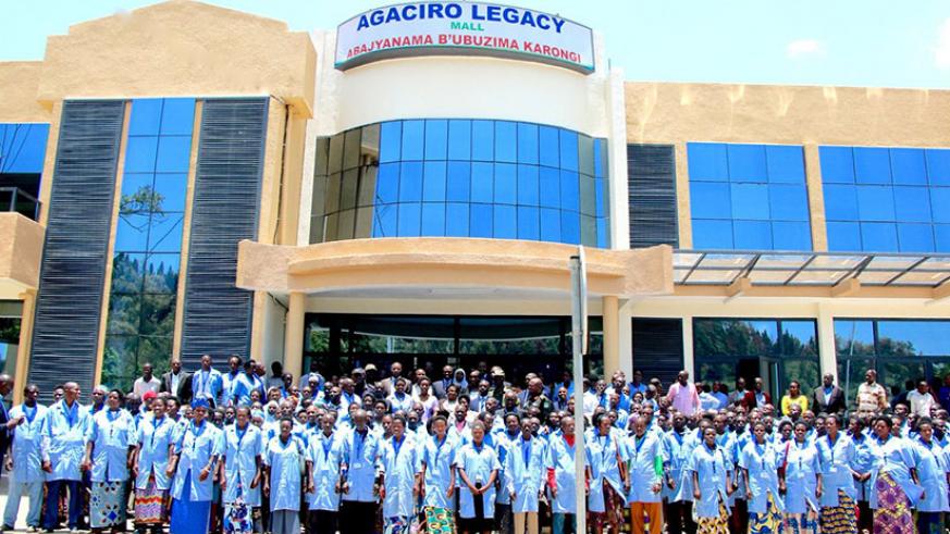 Community Health Workers in Karongi District stand in front of their Agaciro Legacy Mall, a two-floor-commercial building intended to generate income for their welfare. / File photo