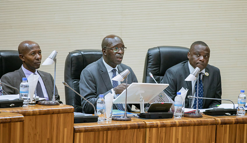 Chief Ombudsman, Anastase Murekezi speaks during the presentation of the 2018/2019 annual report before members of both chambers of parliament yesterday. Looking on are Hon. Musa Fazil Harerimana (left) and Clement Musangabatware, Deputy Ombudsman in charge of preventing and fighting corruption (right). Photo/E. Kwizera.