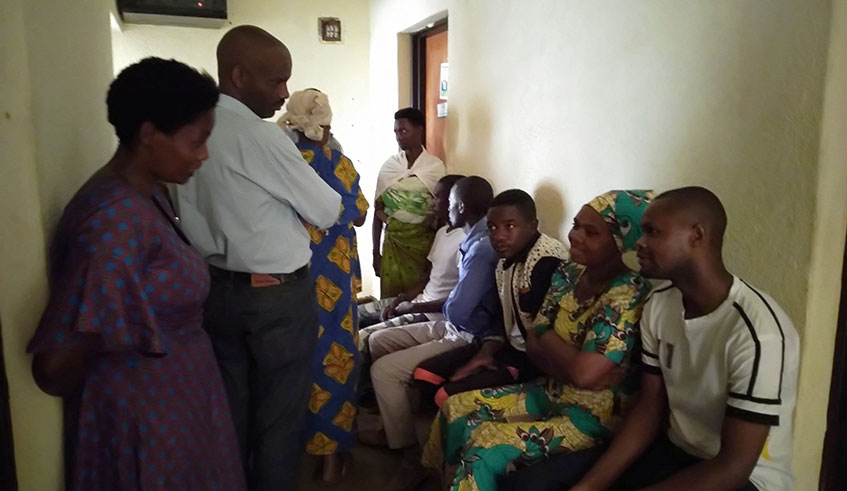 Residents queue at the offices of  Tumba Sector, Huye District for civil registration and notary services. Photo: Ru00e9gis Umurengezi.
