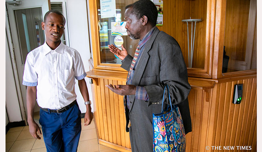 An old man speaks to an employee of the Ombudsmanu2019s Office in Kigali on November 5, 2019. Emmanuek Kwizera.
