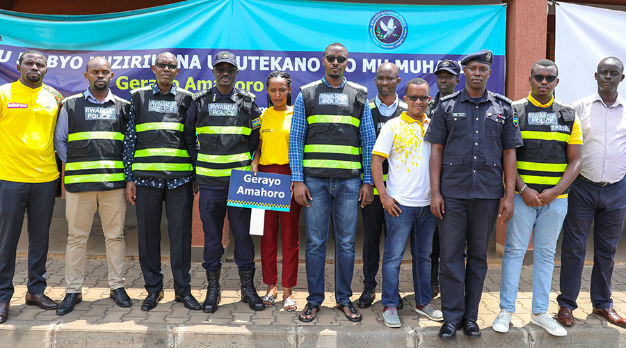 Rwanda National Police officers with MTN-Rwanda staff, drivers and other stakeholders pose for a group photo during the road safety campaign against distractive driving and riding, aimed at preventing the use of phone while on the wheel. / Courtesy