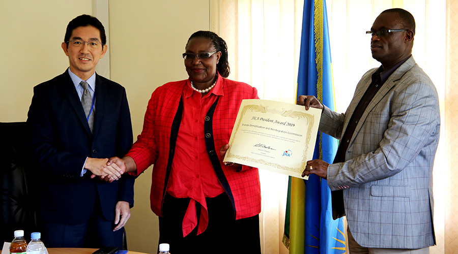 (L-R)The Chief Representative of JICA in Rwanda, Maruo Shin, Chairperson of RDRC Saraphine Mukantabana, Commissioner of RDRC Fred Nyamurangwa receive the President Award. (Craish Bahizi)