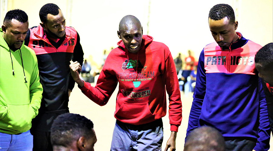 Carey Francis Odhiambo gives instructions to Patriots players during his first game in charge against IPRC-South last Wednesday. The game ended 97-76 in favour of his side. / Sam Ngendahimana