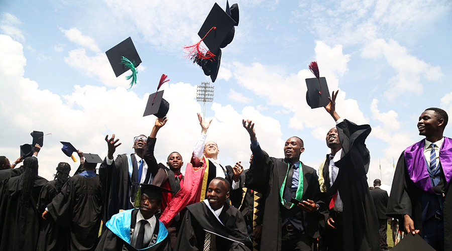 Prof Philipp Cotton, the University Vice-Chancelllor (C) celebrates with graduands during the graduation ceremony.