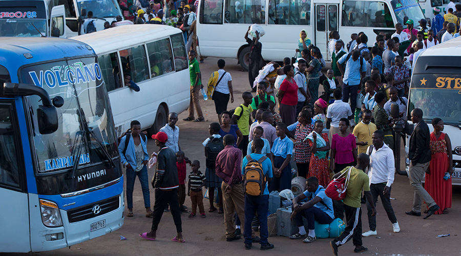 Secondary school students wait for taxis at Nyabugogo park as term comes to an end. / Emmanuel Kwizera