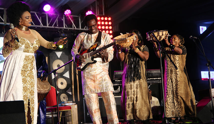 Malian songstress Sangaru00e9 (left) performs with her band during the u2018She mattersu2019 concert at Camp Kigali, Sunday night./ Photos by Dan Nsengiyumva.