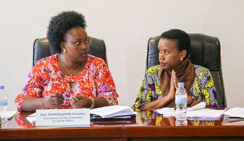 Christine Muhongayire, the Chairperson of the parliamentary Standing Committee on Social Affairs, and Minister for Public Service and Labour Fanfan Rwanyindo, chat during the meeting yesterday. Photo: Craish Bahizi.