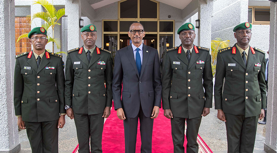 President Paul Kagame, the Commander in Chief of Rwanda Defence Force (RDF), poses with newly appointed top military leaders, Gen Jean-Bosco Kazura, RDF Chief of Defence Staff (2nd left); Gen Fred Ibingira, Chief of Staff, Reserve Force (2nd right); Lt. Gen Jack Musemakweli, Inspector General of RDF (right); and Maj Gen Innocent Kabandana, the deputy Reserve Force Chief of Staff (left), after they were sworn-in at the Parliamentary Builidings, Kimihurura, yesterday. The President warned those seeking to destabilise Rwanda that he was ready to raise the stakes to protect Rwandans. / Village Urugwiro