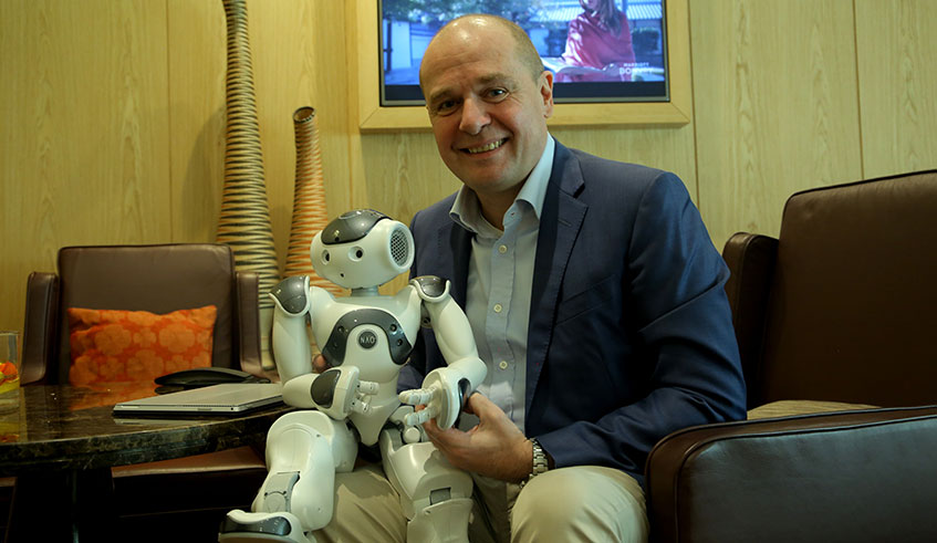 Fabrice Goffin, the founder of Zora Bots, holds one of the robots produced by his company in Kigali on Friday. Photo: Craish Bahizi.
