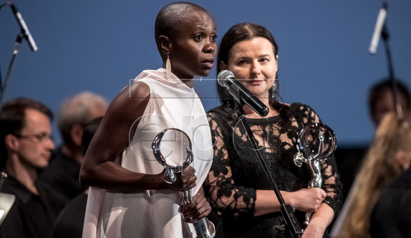 Filmmaker Eliane Umuhire (holding an award) acted in Birds Are Singing in Kigali, an award-winning films that will be among the movies to be screened at the festival. Courtesy.