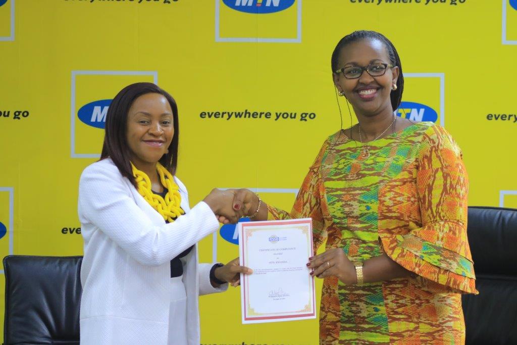 MTN Rwanda CEO Mitwa Ng'ambe (L) and RSSBu2019s Deputy Director General in charge of benefits, Dr. Hakiba Solange (R) during the announcement of the MTN Rwanda subsidy towards Mutuelle de Sante at their headquarters on Wednesday.