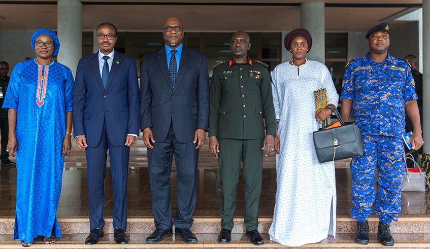 Officials from Gambia's defence ministry pose for a group photo with Major General Albert Murasira (2nd left), Rwanda's minister of defence.
