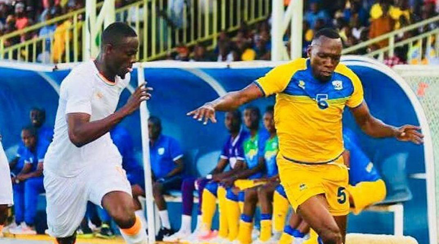 Meddie Kagere (R) is seen here trying to dribble past Manchester United defender Eric Bailly during Rwanda's past match against Cu00f4te d'Ivoire. / File