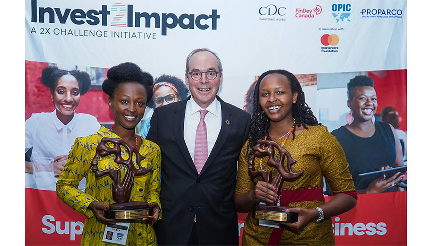FinDev Canada Managing Director, Paul Lamontagne (centre) congratulates winners of the Invest2impact awards. On the left is Blandine Umiziranenge of Kosmotive and Yvette Ishimwe of Iriba were the best in their respective categories.