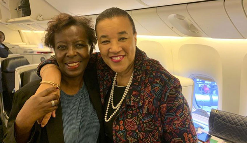 The secretary general of la Francophonie, Louise Mushikiwabo(L) embraces the Secretary general of the Commonwealth, Patricia Scotland as they prepare to travel to Cameroon. (Net photo)