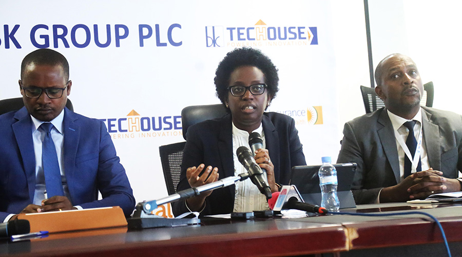 Bank of Kigali CEO Diane Karusisi (C) addresses the media, and Jean Claude Munyangabo, the CEO of BK TecHouse and BK General Insurance CEO Alex Bahizi look on in Kigali yesterday. BK Group PLC has recorded a profit of Rwf25 billion in the first nine months of 2019, with its subsidiary commercial bank and insurance firms having the largest impact on its growth. / Sam Ngendahimana