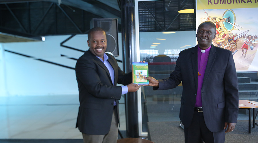 (L-R) The Permanent Secretary of Minister of Local Government, Samuel Dusengiyumva, and Bishop Bilindabagabo at the launch of u201cGoliyati Araguyeu201d book on Friday November 29, at Kigali Public Library. / Courtesy