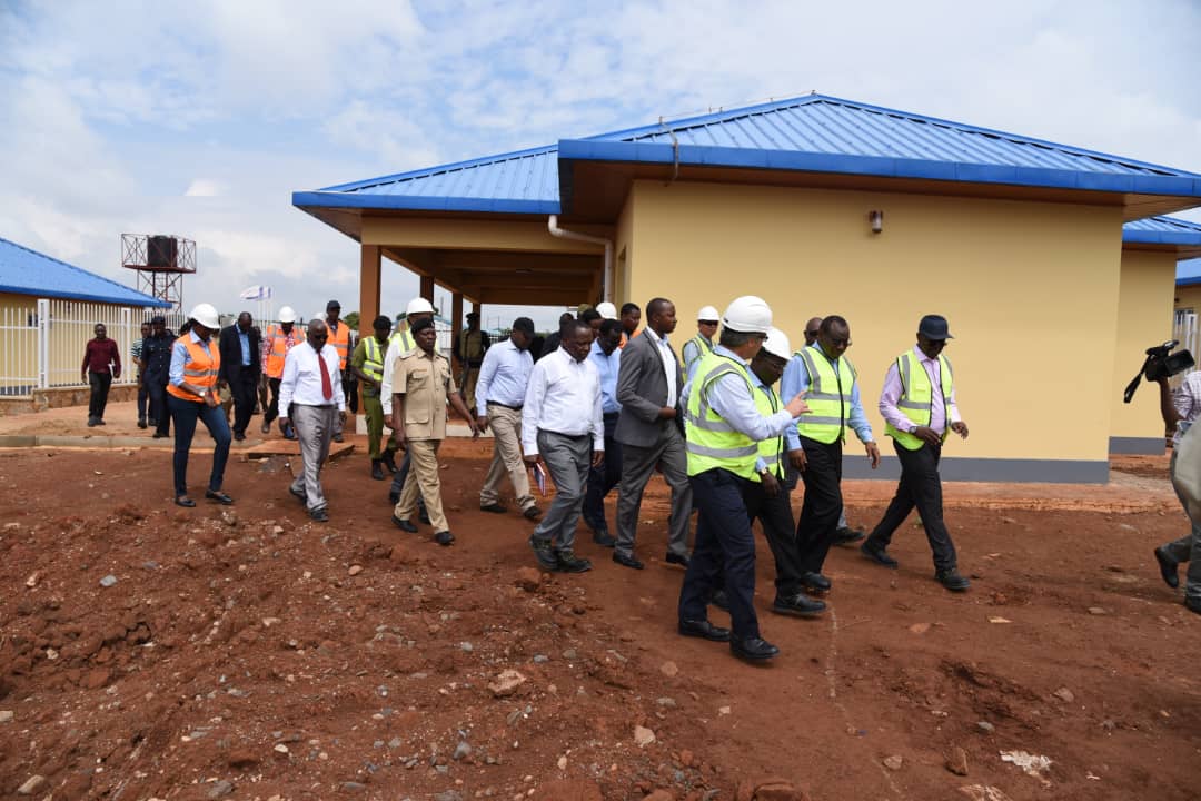 The ministers and project officials tour houses for people who will work at the power plant. The accommodations are in Tanzania, five kilometres from the Rusumo border. This is also where a temporary camp for the current project's workforce is located.