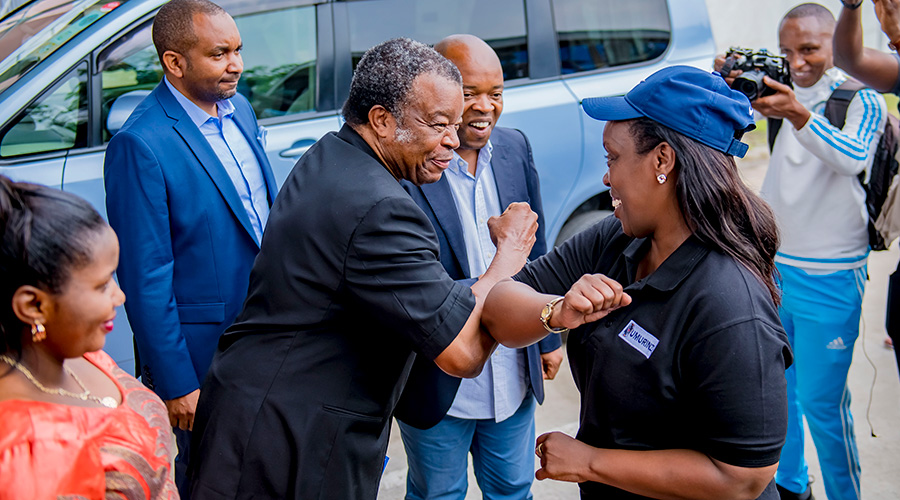 Health Minister, Dr. Gashumba greets Jean-Jacques Muyembe, the coordinator of the Ebola response in DR Congo. Both officials were showing local residents how to greet without shaking hands as one of the ways to prevent the spreading of EVD. 