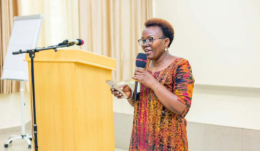 Alice Anukur, the Country Director of Oxfam Rwanda speaks at the meeting. Courtesy.