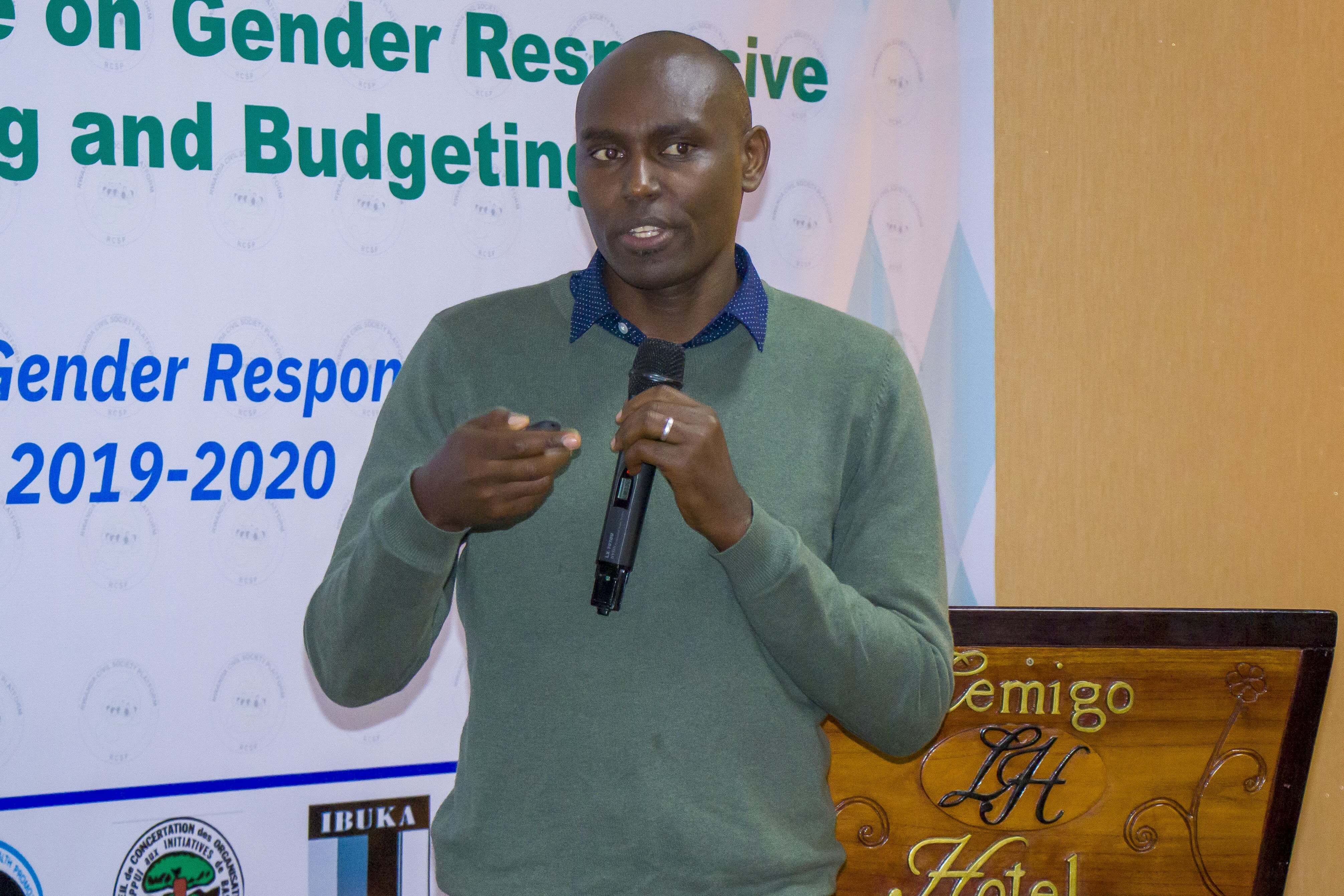 Johnson Rukundo, a researcher presenting findings of a study on gender-responsive budgeting