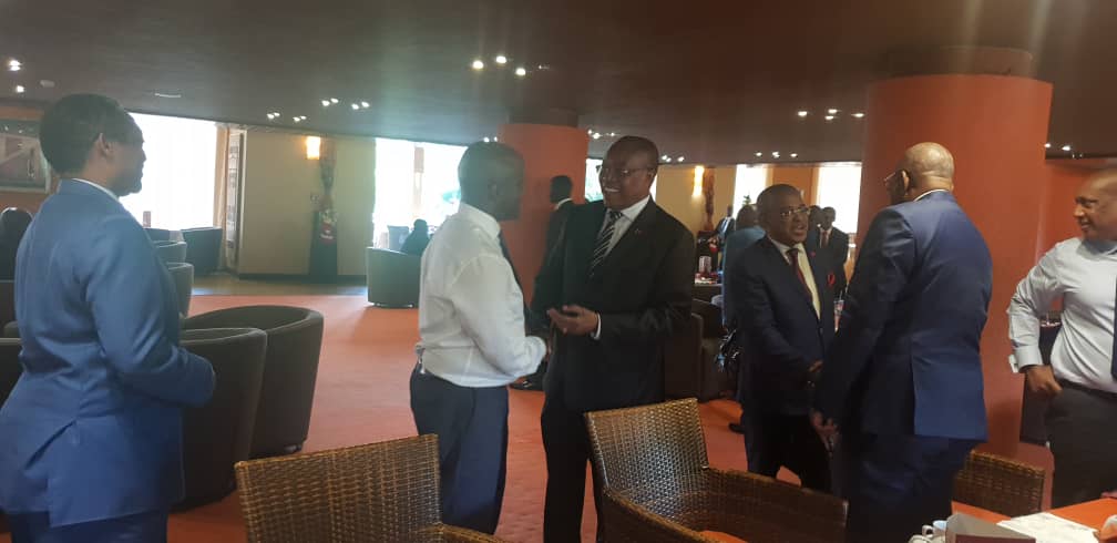 Angola's Foreign minister, Manuel Domingos Augusto and his delegation were greeted by Amb. Olivier NduhungireheÂ (in white shirt)Â when they arrived In Kampala.