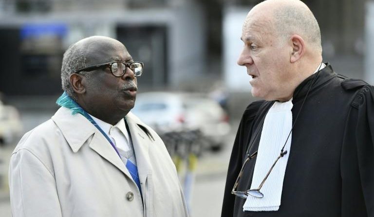 Fabien Neretse with his lawyer. 