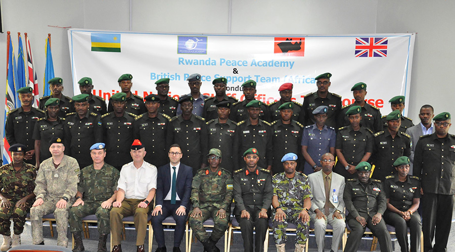 Officials from the United Kingdom High Commission in Rwanda and Rwanda's Ministry of Defense pose with senior and junior military officers from RDF who attended a 2 week UN Staff Officers Training at Rwanda Peace Academy. 