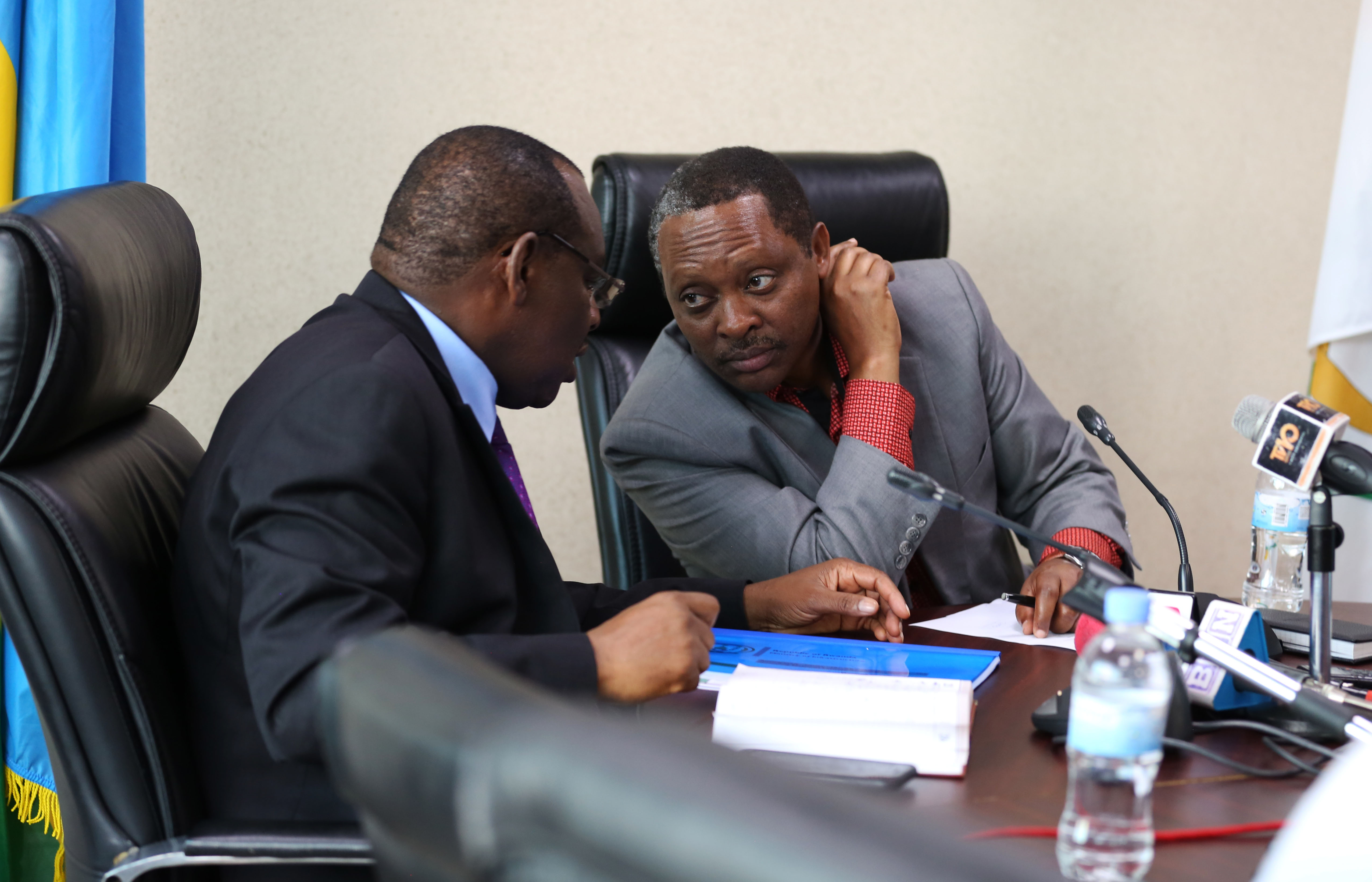Minister of Local Government Prof Anastase Shyaka consults with Minister of Infrastructure Claver Gatete during a press conference in Kigali yesterday (Sam Ngendahimana)