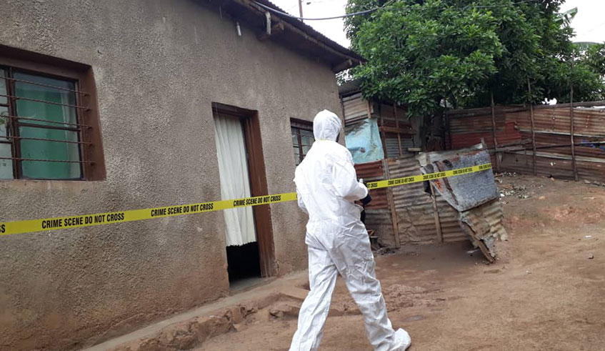 A Rwanda Investigation Bureauu2019s specialist during investigation.It is said that  rape was committed in this house in Remera more than 2 years ago. Photo: Courtesy.