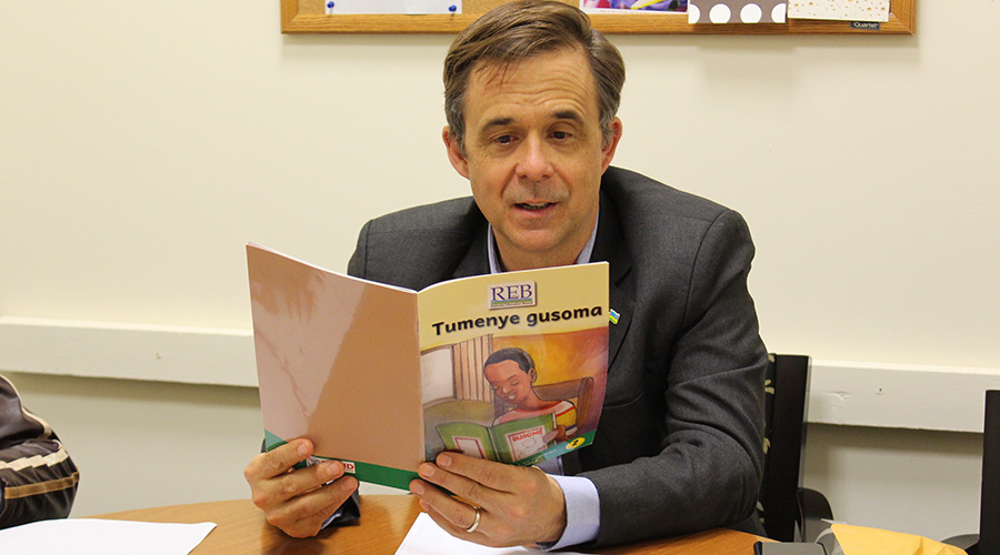 Peter Hendrick Vrooman, the US ambassador to Rwanda, uses a local book, u2018Tumeye Gusomau2019, to learn Kinyarwanda. 