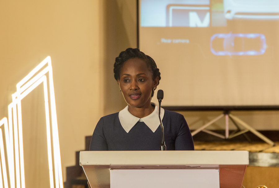 Ms. Judith Muhongerwa, the Victoria Motors Rwanda LTD Board Chair gives her remarks during the launch of the PHEV Outlander on Friday 20 December. / Dan Nsengiyumva